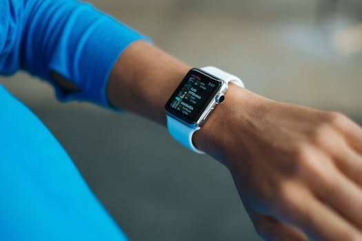 Focus on a smartwatch worn on an adult's wrist, showcasing its digital display. smart watches for men.